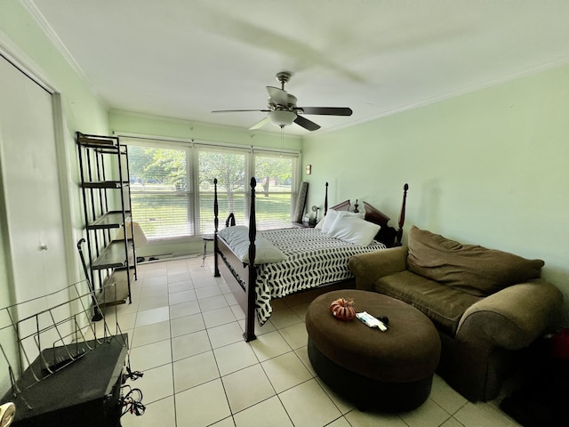 bedroom featuring ceiling fan, crown molding, and light tile floors