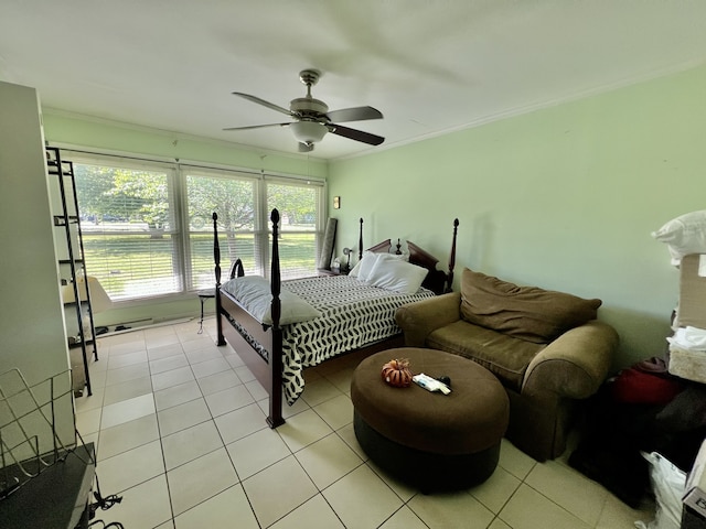 bedroom with crown molding, ceiling fan, and light tile floors