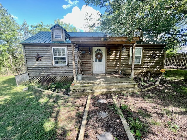 log home with a front lawn