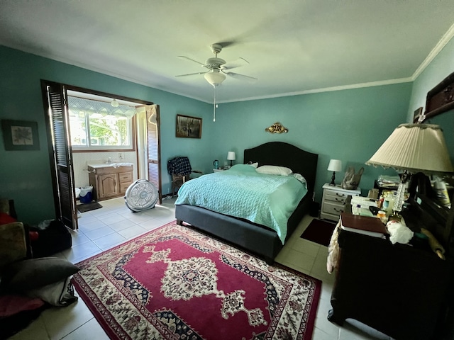 tiled bedroom with ceiling fan, crown molding, and connected bathroom