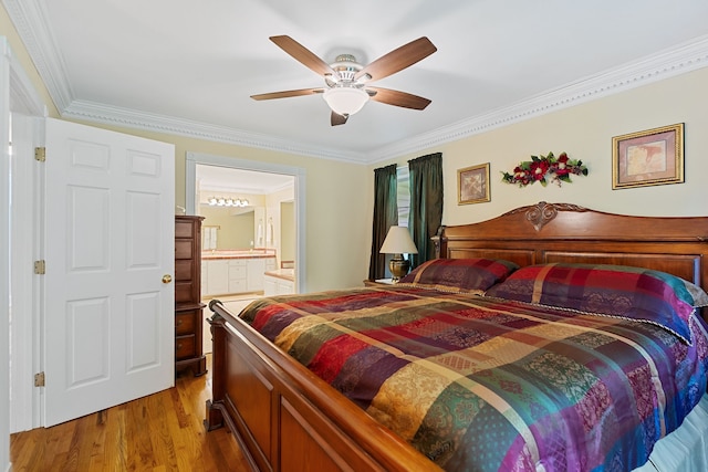 bedroom featuring ornamental molding, ensuite bath, wood-type flooring, and ceiling fan