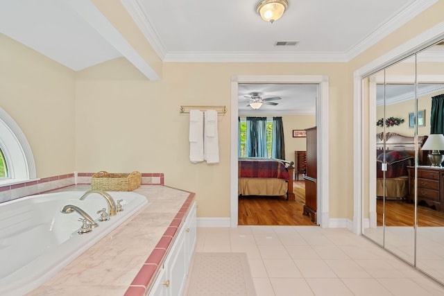 bathroom featuring plenty of natural light, crown molding, ceiling fan, and hardwood / wood-style floors