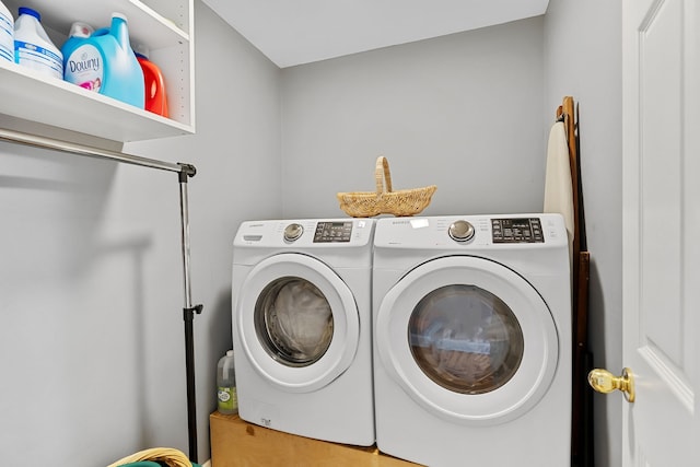 clothes washing area with washing machine and clothes dryer