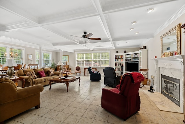 tiled living room featuring a fireplace, ceiling fan with notable chandelier, beam ceiling, ornamental molding, and coffered ceiling