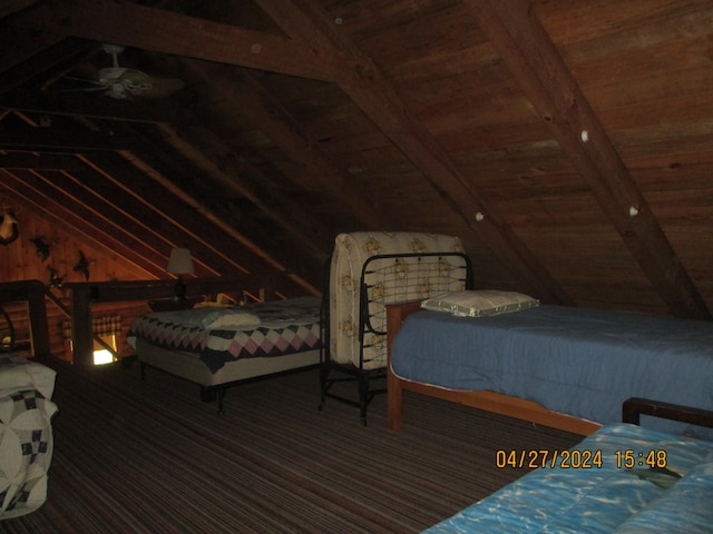 bedroom featuring wooden ceiling and vaulted ceiling with beams