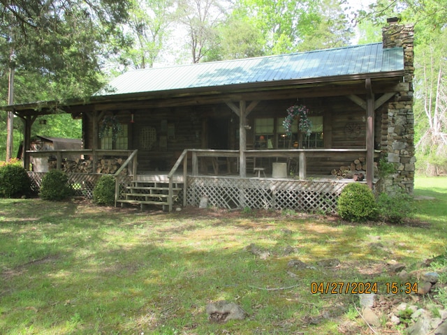 rear view of house with a yard