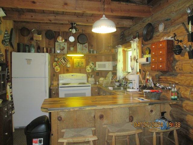 kitchen featuring white appliances, sink, and beam ceiling