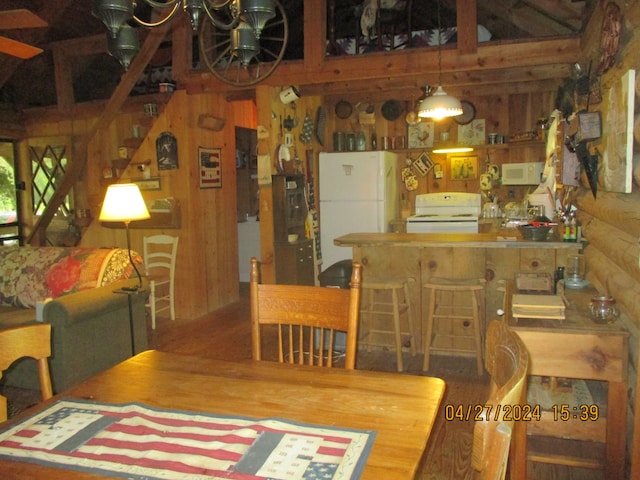 dining area with wood walls