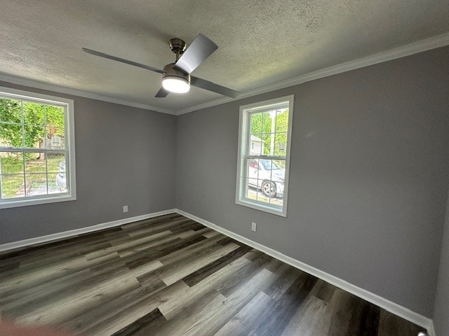 empty room featuring crown molding, dark hardwood / wood-style flooring, ceiling fan, and a textured ceiling