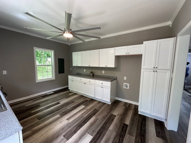 kitchen with white cabinets, ceiling fan, dark wood-type flooring, and ornamental molding