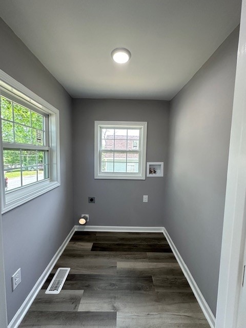 spare room featuring dark hardwood / wood-style floors