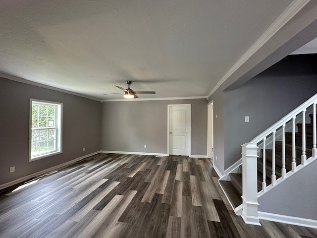 spare room with ornamental molding, dark hardwood / wood-style flooring, and ceiling fan