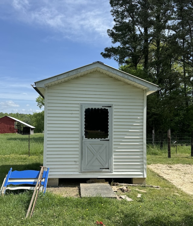 view of outdoor structure with a lawn