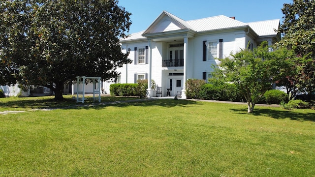 neoclassical / greek revival house with a front lawn