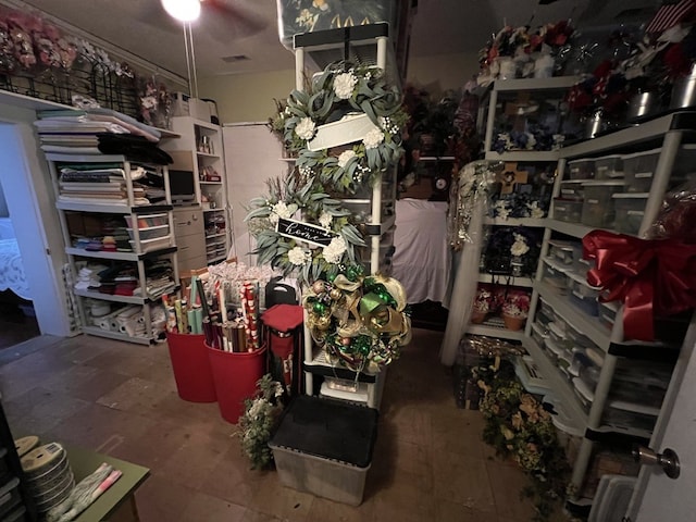 storage area featuring ceiling fan