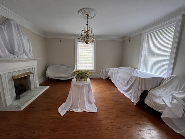 bedroom featuring a notable chandelier, dark wood-type flooring, and crown molding