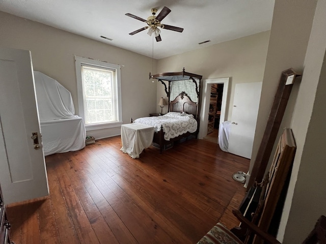 bedroom with hardwood / wood-style floors and ceiling fan