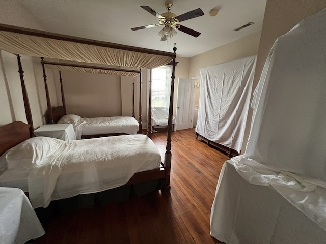 bedroom with wood-type flooring and ceiling fan