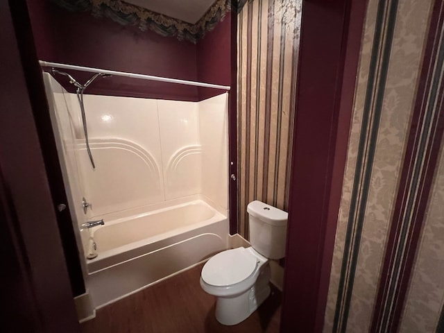 bathroom with shower / bath combo with shower curtain, toilet, and hardwood / wood-style floors