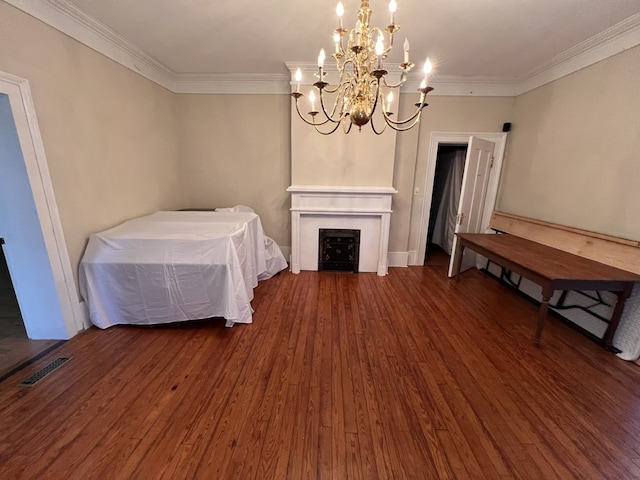 unfurnished bedroom featuring a notable chandelier, dark wood-type flooring, and crown molding