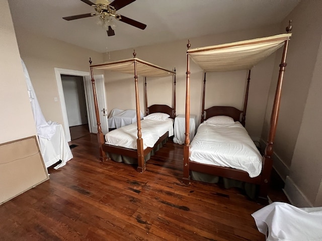 bedroom featuring dark wood-type flooring and ceiling fan