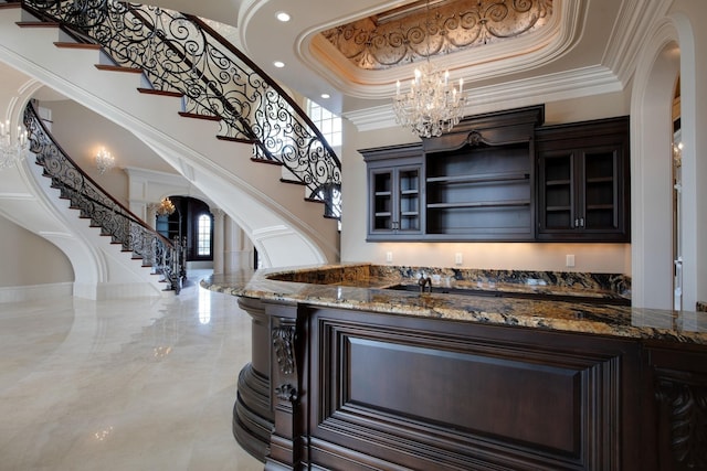 bar with dark brown cabinetry, dark stone counters, and tile flooring