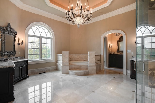 bathroom with a tray ceiling, crown molding, tile floors, vanity, and an inviting chandelier