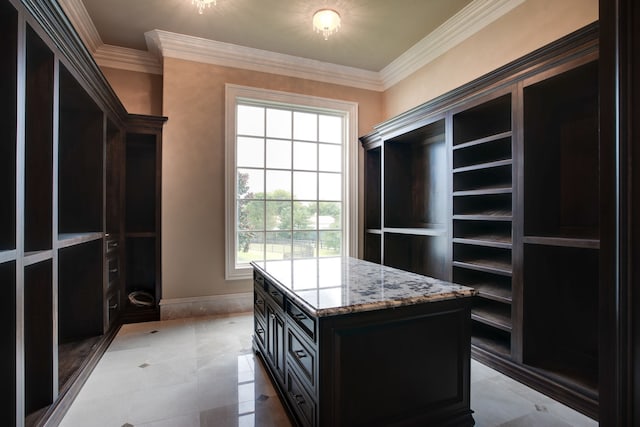 walk in closet featuring light tile flooring