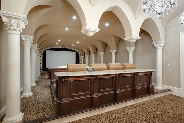 interior space with a notable chandelier and ornate columns