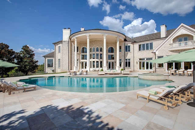 view of swimming pool with a patio area