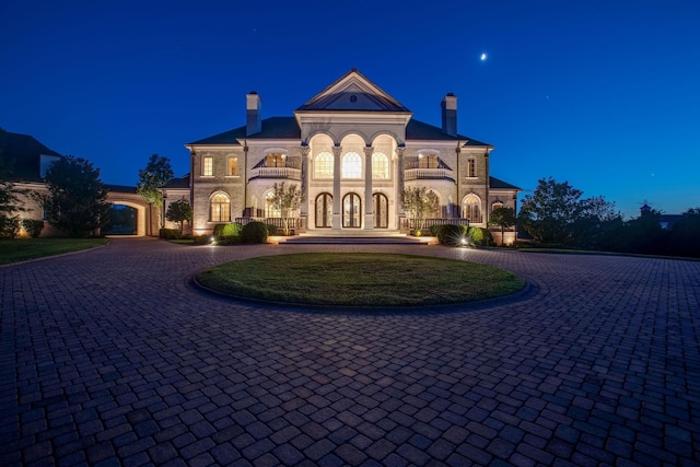 view of front of house featuring a balcony