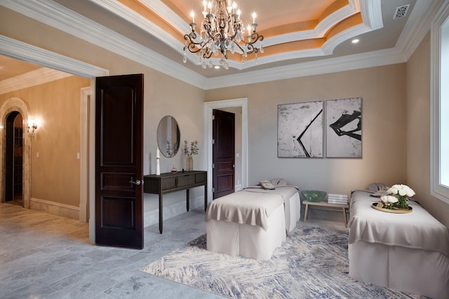 sitting room with a raised ceiling, a notable chandelier, tile floors, and ornamental molding