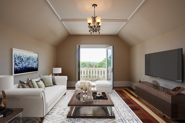 living room featuring wood-type flooring, vaulted ceiling, and an inviting chandelier