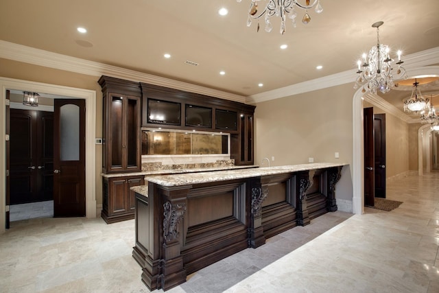 bar with light stone counters, pendant lighting, dark brown cabinetry, and light tile flooring