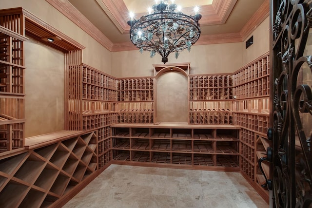 wine room featuring an inviting chandelier, tile flooring, crown molding, and a high ceiling