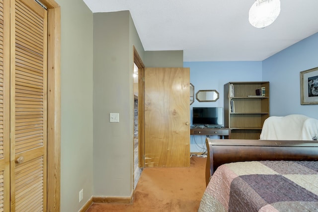 carpeted bedroom featuring a closet