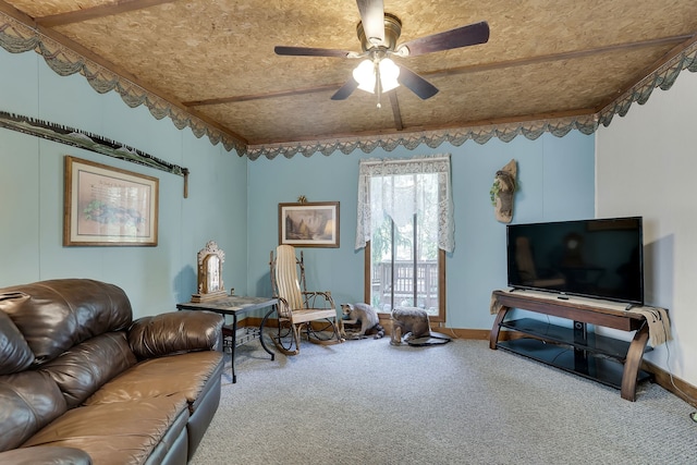 carpeted living room featuring ceiling fan