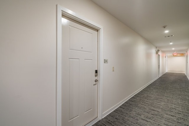 hallway with dark carpet