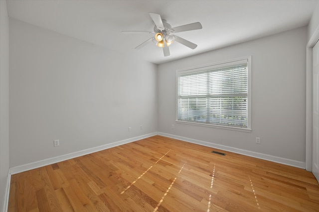 unfurnished room featuring light hardwood / wood-style floors and ceiling fan