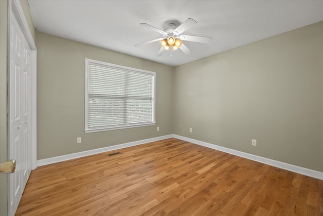 empty room featuring light hardwood / wood-style floors and ceiling fan