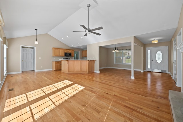 unfurnished living room with high vaulted ceiling, ceiling fan, and light hardwood / wood-style floors