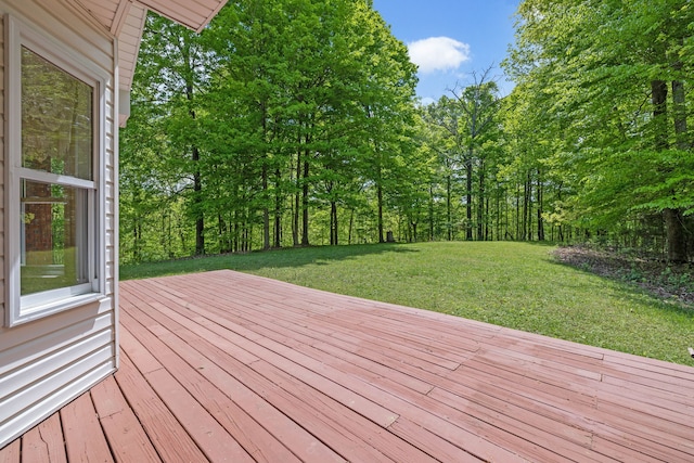 wooden terrace with a lawn