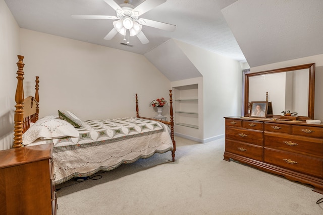 carpeted bedroom featuring a textured ceiling, vaulted ceiling, and ceiling fan