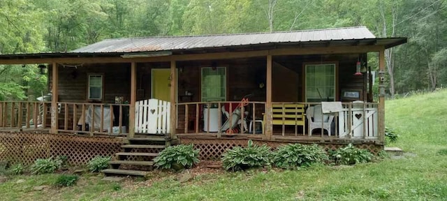 back of house featuring a wooden deck