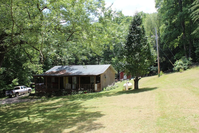 view of yard with covered porch