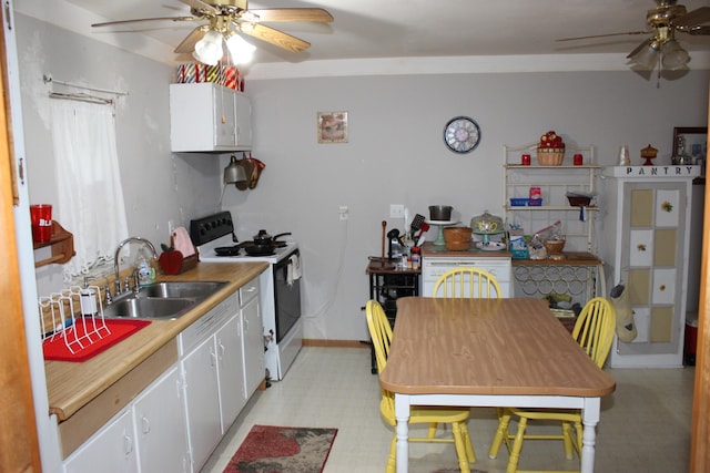 kitchen with sink, white cabinets, white range with gas stovetop, and ceiling fan