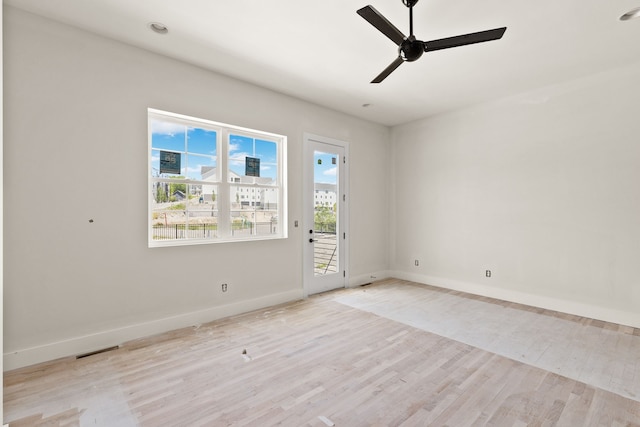 spare room featuring ceiling fan and light hardwood / wood-style flooring