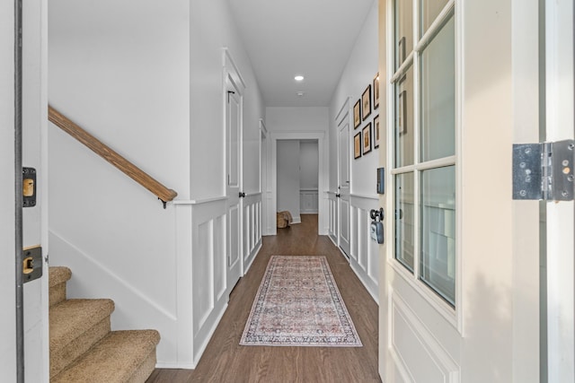 corridor featuring dark wood-style floors, stairway, and recessed lighting