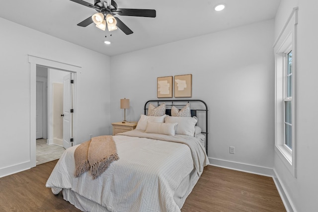 bedroom with a ceiling fan, recessed lighting, baseboards, and wood finished floors