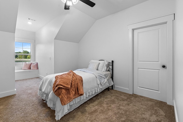 carpeted bedroom with vaulted ceiling, ceiling fan, visible vents, and baseboards